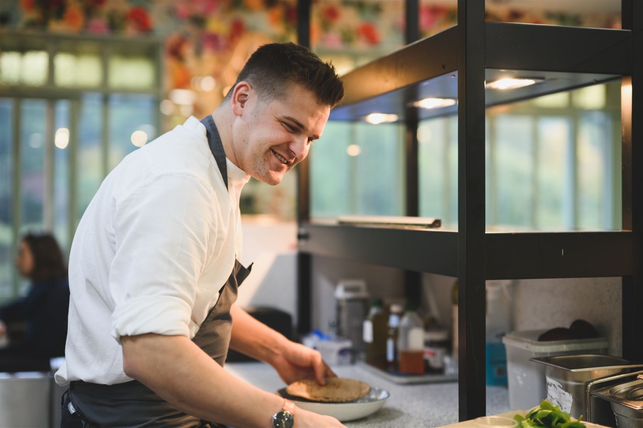 New Regent's Park café chef in kitchen with food on plates
