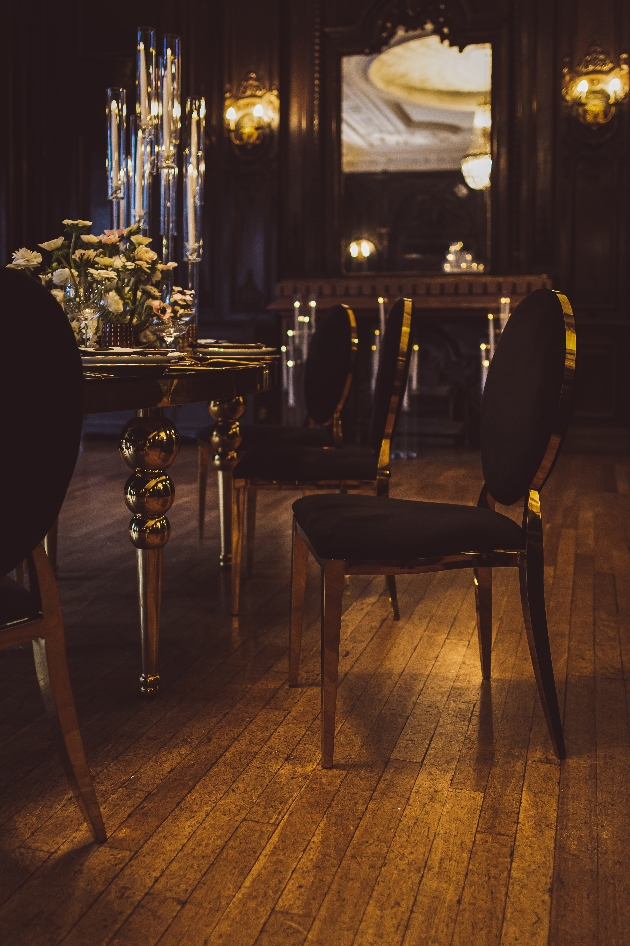 chairs and and tables at dark lit recpetion dinner