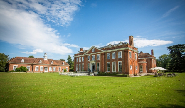 manor house redbrick white details sunny day