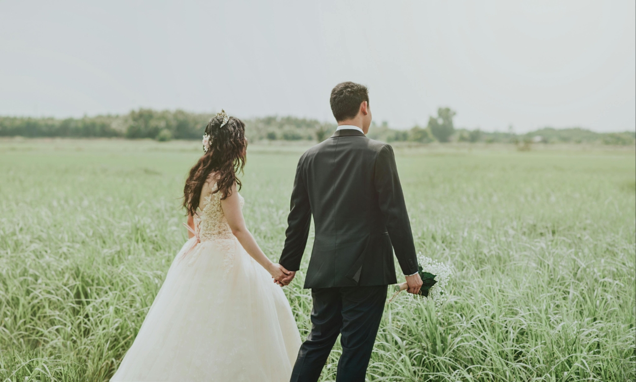 couple walking in field