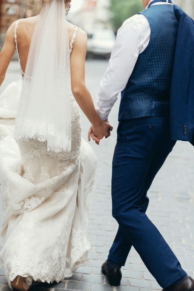 married couple walking hand in hand