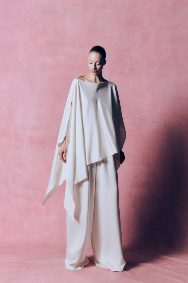 fluid suit has a draped shawl top with flowing trousers