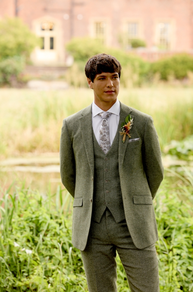 male model in a green suit