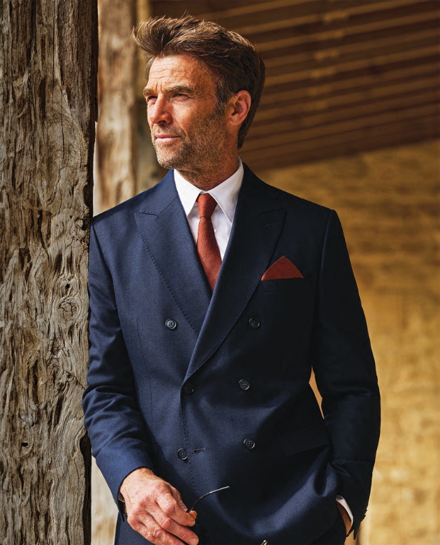 Male model wearing a Brook Taverner Suit